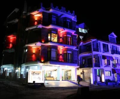 https://imgcld.yatra.com/ytimages/image/upload/t_hotel_yatra_city_desktop/v1433479470/Domestic Hotels/Hotels_Dalhousie/Hotel Grace Mount/building-view-night.jpg